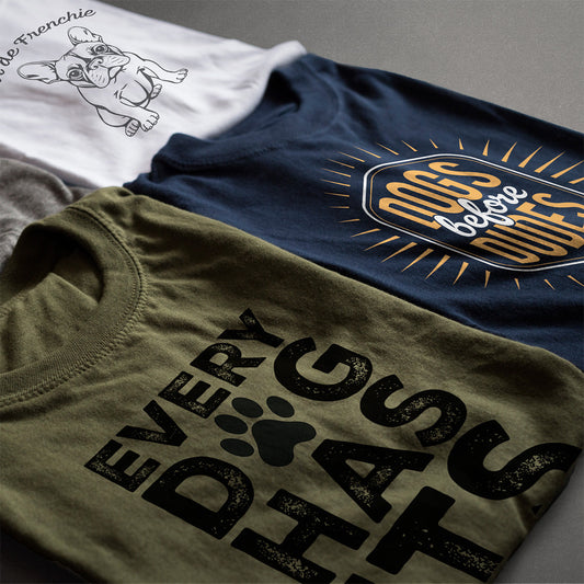 Flat lay of three Hero & Starr graphic tees—‘Tour de Frenchie,’ ‘DOGS before DUDES,’ and ‘EVERY DOG HAS ITS DAY—highlighting dog lover apparel styles.